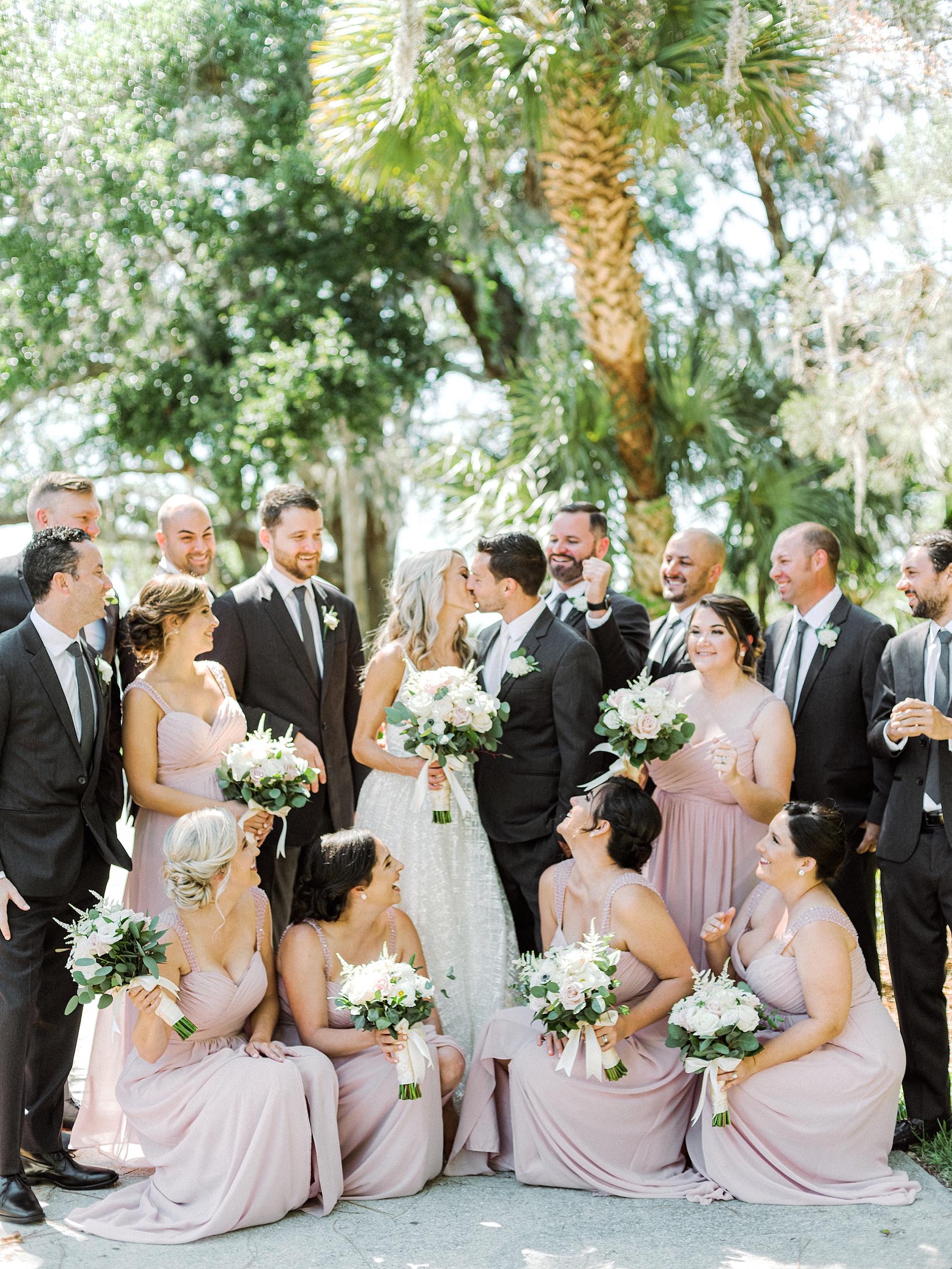Sarasota Bride and Groom Kissing, Bridesmaids in Blush Pink Dresses, Groomsmen in Gray Suits Wedding Party Portrait