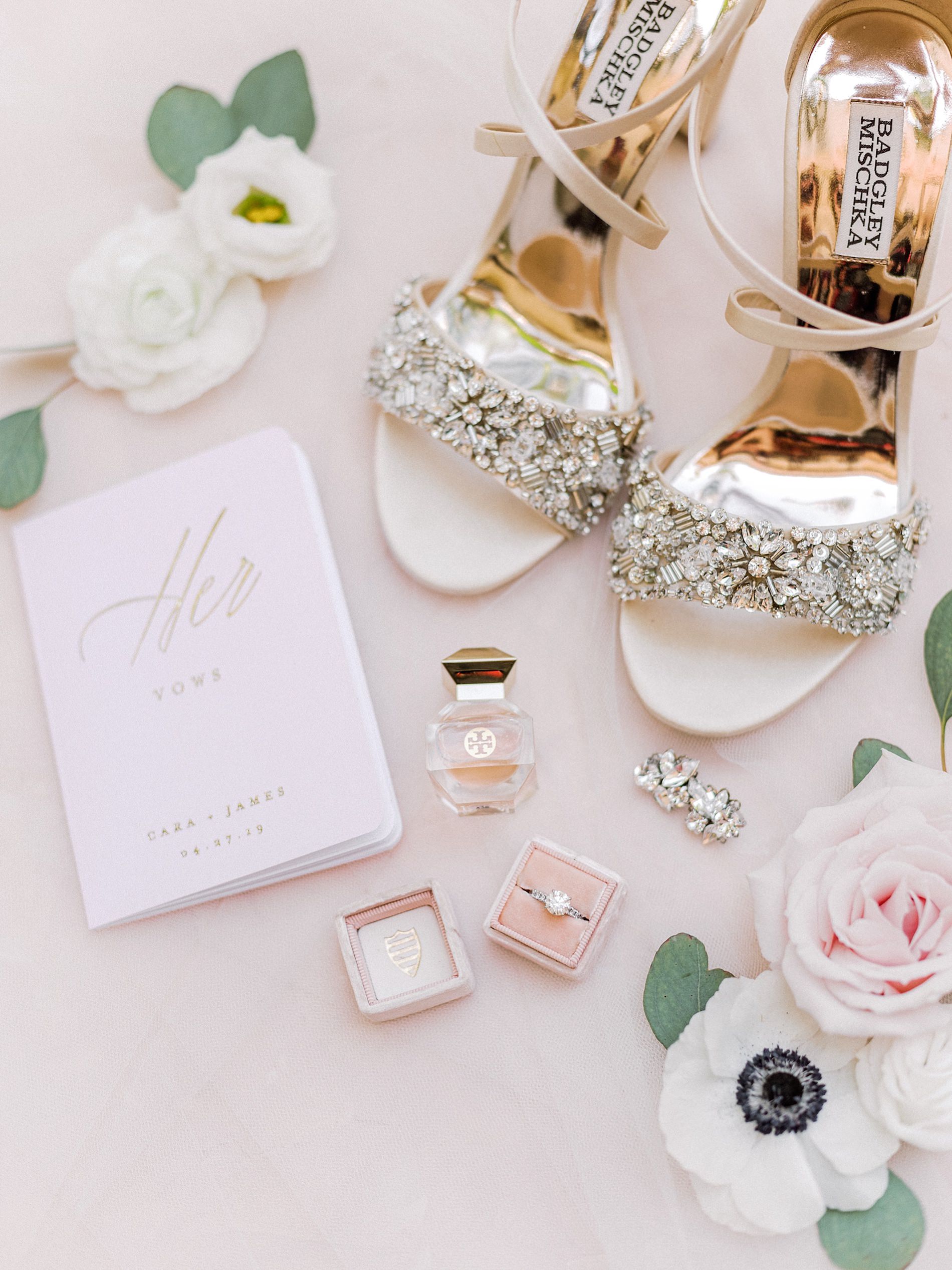 Badgley Mischka Ivory Chunky Rhinestone Strappy Sandal Wedding Shoes, Gold Foil Her Vows Book, Solitaire Round Diamond Engagement Ring in Blush Pink Ring Box