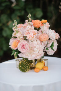 Romantic Whimsical Wedding Reception Decor, Blush Pink Hydrangeas, Orange and Pink Roses in Gold Vase Low Floral Centerpiece with Oranges and Lemon Fruits | Tampa Bay Wedding Florist Bruce Wayne Florals
