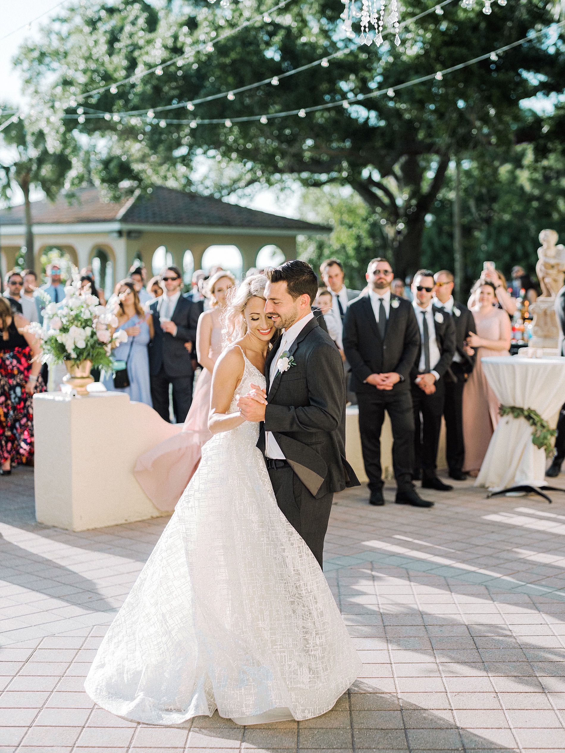 Romantic Bride and Groom Courtyard First Dance Wedding Reception Portrait | Sarasota Wedding Venue Powel Crosley Estate