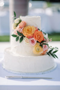 INSTAGRAM Two Tier Classic Textured Buttercream Wedding Cake with Real Blush Pink, Orange and Ivory Roses Cascading | Tampa Bay Wedding Florist Bruce Wayne Florals