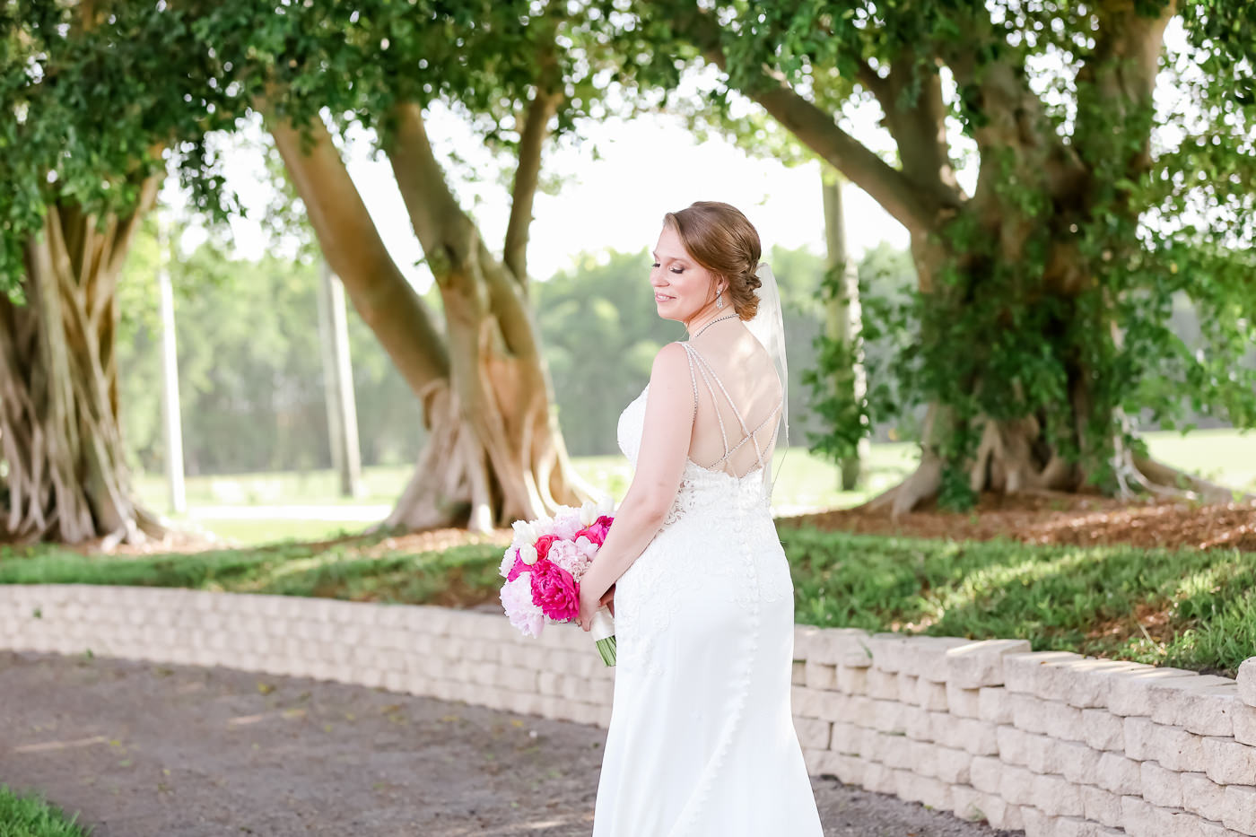 Bride Beauty Wedding Portrait in Romantic Fitted Stella York Lace Dress with Beaded Criss Cross Straps Holding Pink Floral Bouquet | Tampa Bay Wedding Photographer Lifelong Photography Studios | Wedding Hair and Makeup Michele Renee the Studio