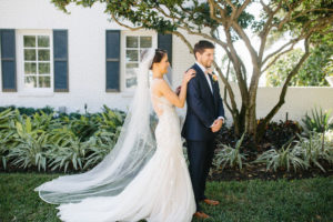 Fun Bride and Groom First Look Portrait, Bride in Romantic Lace and Illusion Watters Fit and Flare Wedding Dress with Full Length Veil | Tampa Bay Wedding Hair and Makeup Femme Akoi Beauty Studio