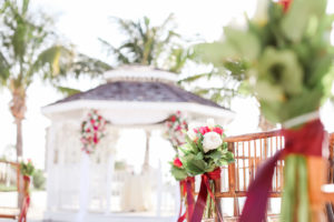 Tropical Wedding Ceremony Decor, White Tulips, Red and Greenery Floral Arrangements | Tampa Bay Wedding Photographer Lifelong Photography Studios | Waterfront St. Pete Wedding Venue Isla Del Sol Yacht and Country Club