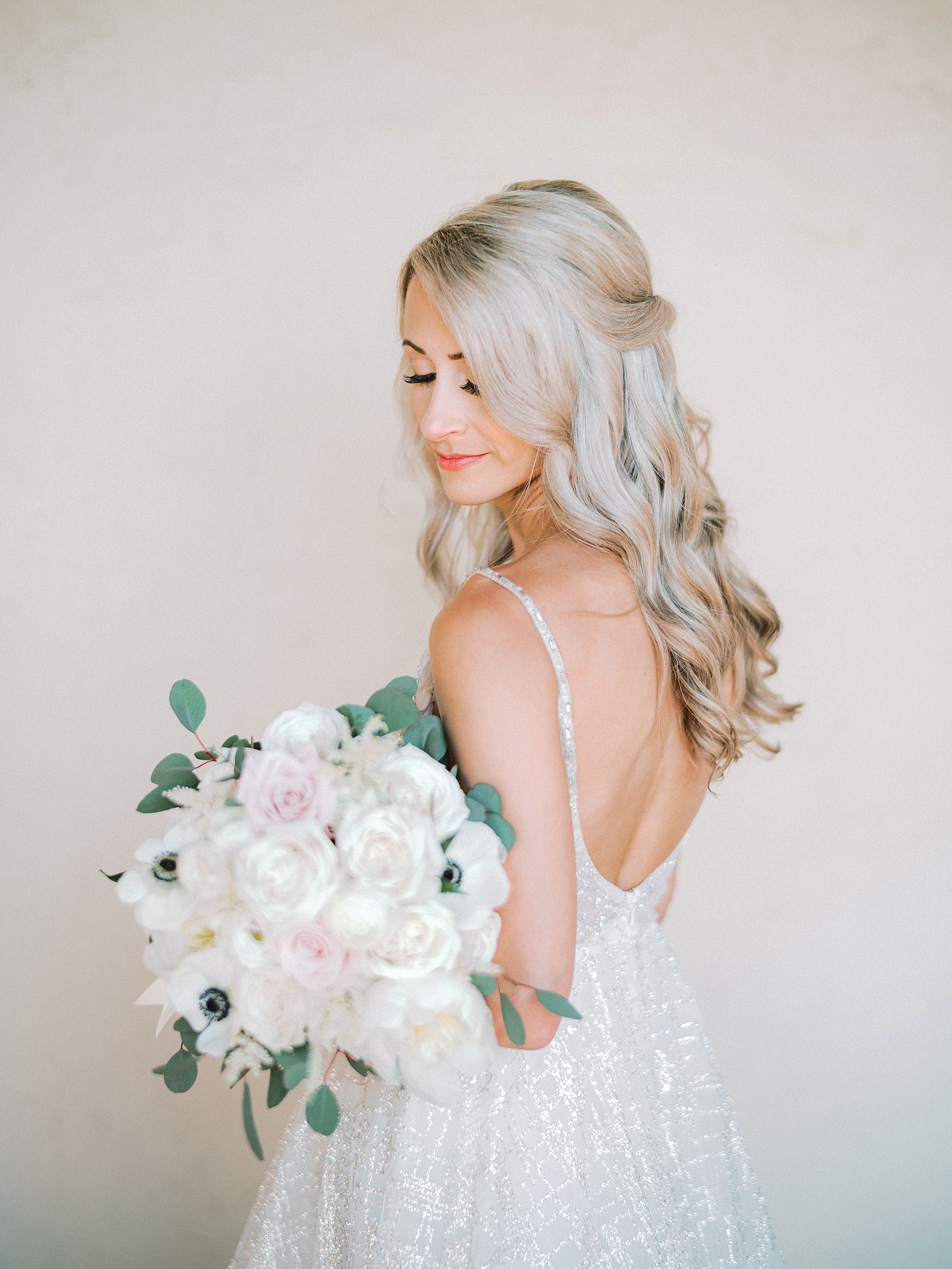 Tampa Bay Bride Beauty Portrait, Half Up Hairdo Holding Blush Pink and White Roses, Anemone and Greenery Floral Bouquet in Open Back Lazaro Wedding Dress