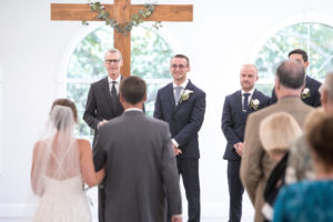 Bride and Groom Traditional Church Wedding Ceremony Processional Portrait | Tampa Bay Wedding Photographer Carrie Wildes Photography | Wedding Venue Harborside Chapel