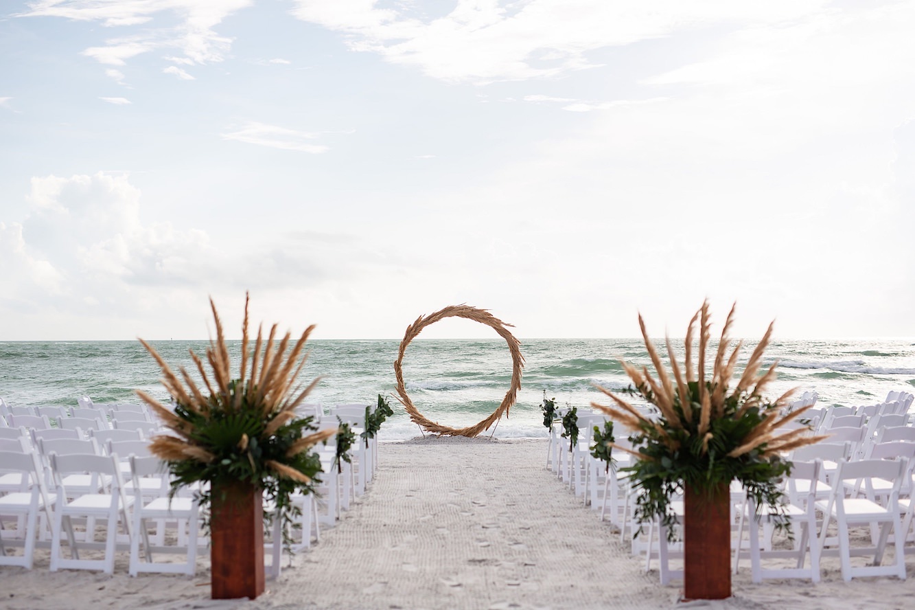 Tropical Boho Outdoor Florida Beach Wedding Ceremony with Straw Circular Geometric Ceremony Arch | Sarasota Wedding Venue Longboat Key Club
