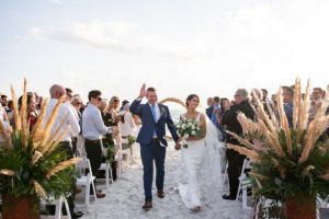 Tropical Outdoor Florida Beach Wedding Ceremony with Straw Circular Geometric Ceremony Arch | Sarasota Wedding Venue Longboat Key Club