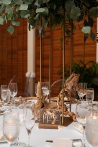 Boho Florida Wedding Reception Decor with Tall Greenery and Birchwood Centerpieces and Clear Acrylic Table Numbers