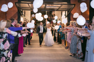 Fun Bride and Groom Wedding Reception Send-Off with Balloons | Tampa Bay Wedding Photographer Carrie Wildes Photography | Industrial Historic Wedding Venue Armature Works | Wedding Planner Love Lee Lane