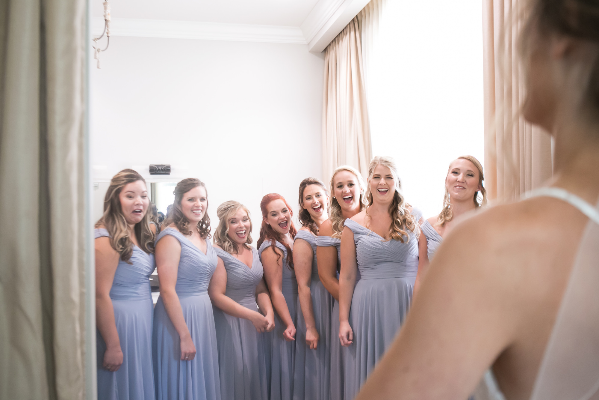 Bridesmaids in Matching Dusty Blue Dresses First Look Wedding Portrait with Bride | Tampa Bay Wedding Photographer Carrie Wildes Photography