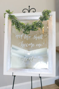 Classic Elegant White Framed Mirror with Script Font Welcome Sign with Greenery Garland | Tampa Bay Wedding Photographer Carrie Wildes Photography | Wedding Planner Love Lee Lane