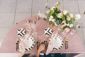 Modern Art Deco Whimsical Inspired Reception Sweetheart Table with Crushed Velvet Linen and Black and White Plates with Gold Glass Charger Plate and Gold Flatware | Tampa Wedding Florist Monarch Events and Designs | Tampa Wedding Rentals Kate Ryan Event Rentals