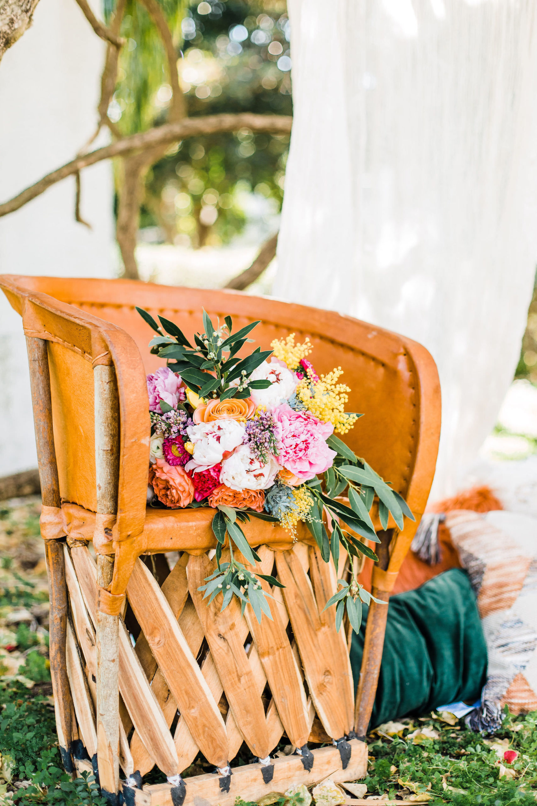 Boho Inspired Watercolor Outdoor Bridal Wooden Chair with Whimsical Colorful Bouquet