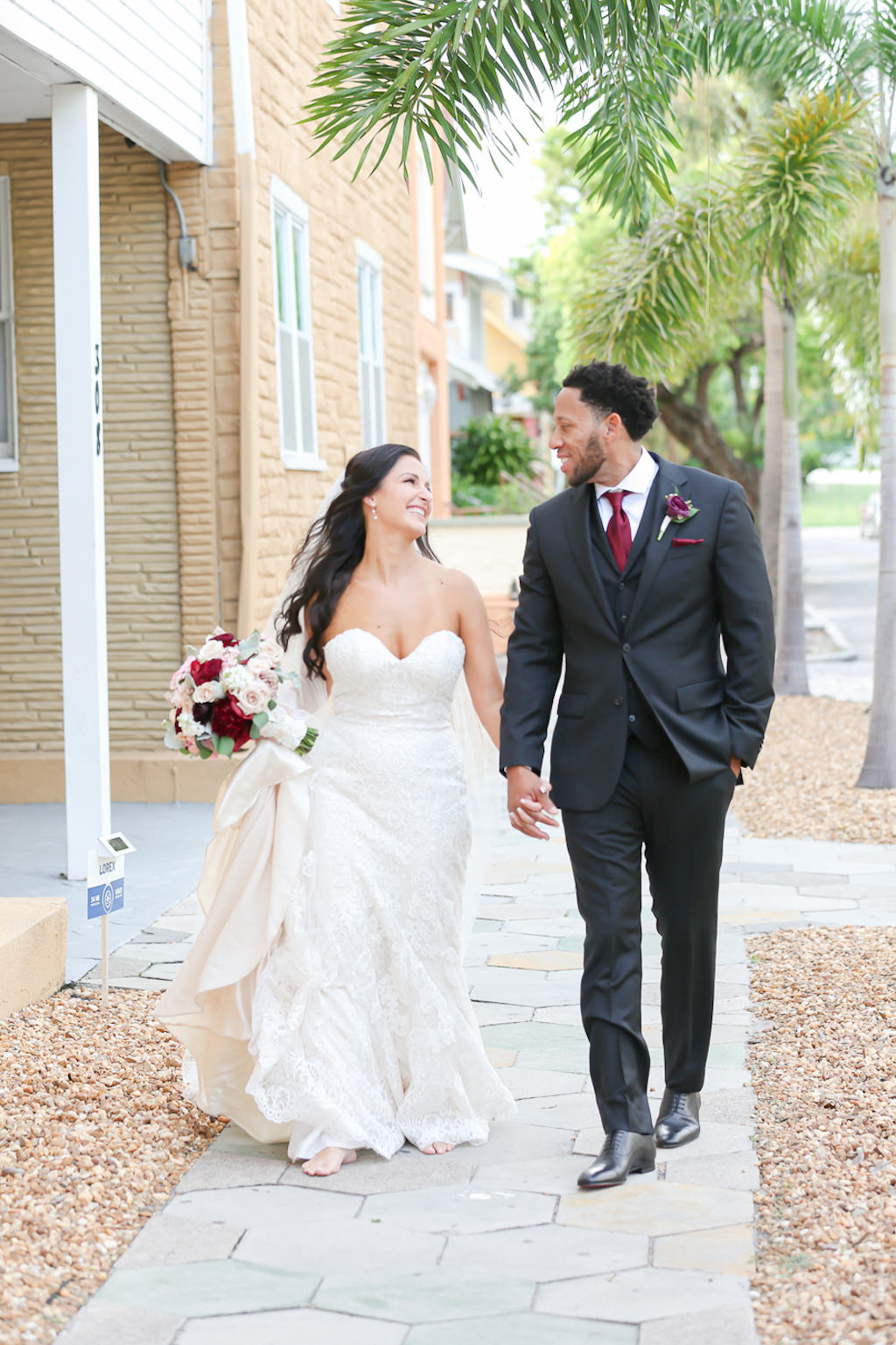 Romantic Tampa Bride in Lace Sweetheart Strapless Neckline Essense of Australia Wedding Dress Holding Wine Red and Blush Pink Roses Floral Bouquet, Groom in Gray Suit with Red Wine Tie and Rose Boutonniere | Wedding Photographer Lifelong Photography Studios