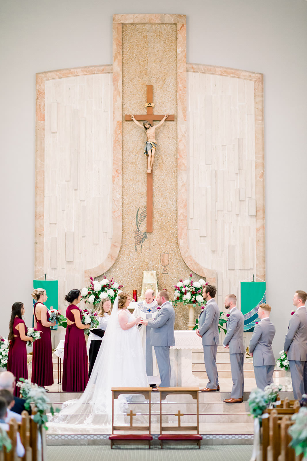 Bride and Groom Exchanging Wedding Vows During Catholic Wedding Ceremony | Tampa Bay Wedding Photographer Shauna and Jordon Photography | St. Pete Wedding Venue St. John Vianney Catholic Church