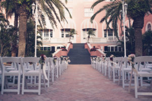Outdoor Hotel Courtyard Wedding Ceremony Portrait | Historic Waterfront Hotel St. Pete Beach Wedding Venue The Don CeSar | Wedding Photographer Luxe Light Images