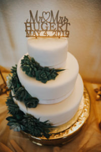 Classic, Garden Inspired Wedding Cake with Smooth Ethereal White Frosting, with Dark Greenery Inspire Succulent Floral Accent, Custom Gold Metal Cake Topper | Florida Wedding Florist Brides N Blooms