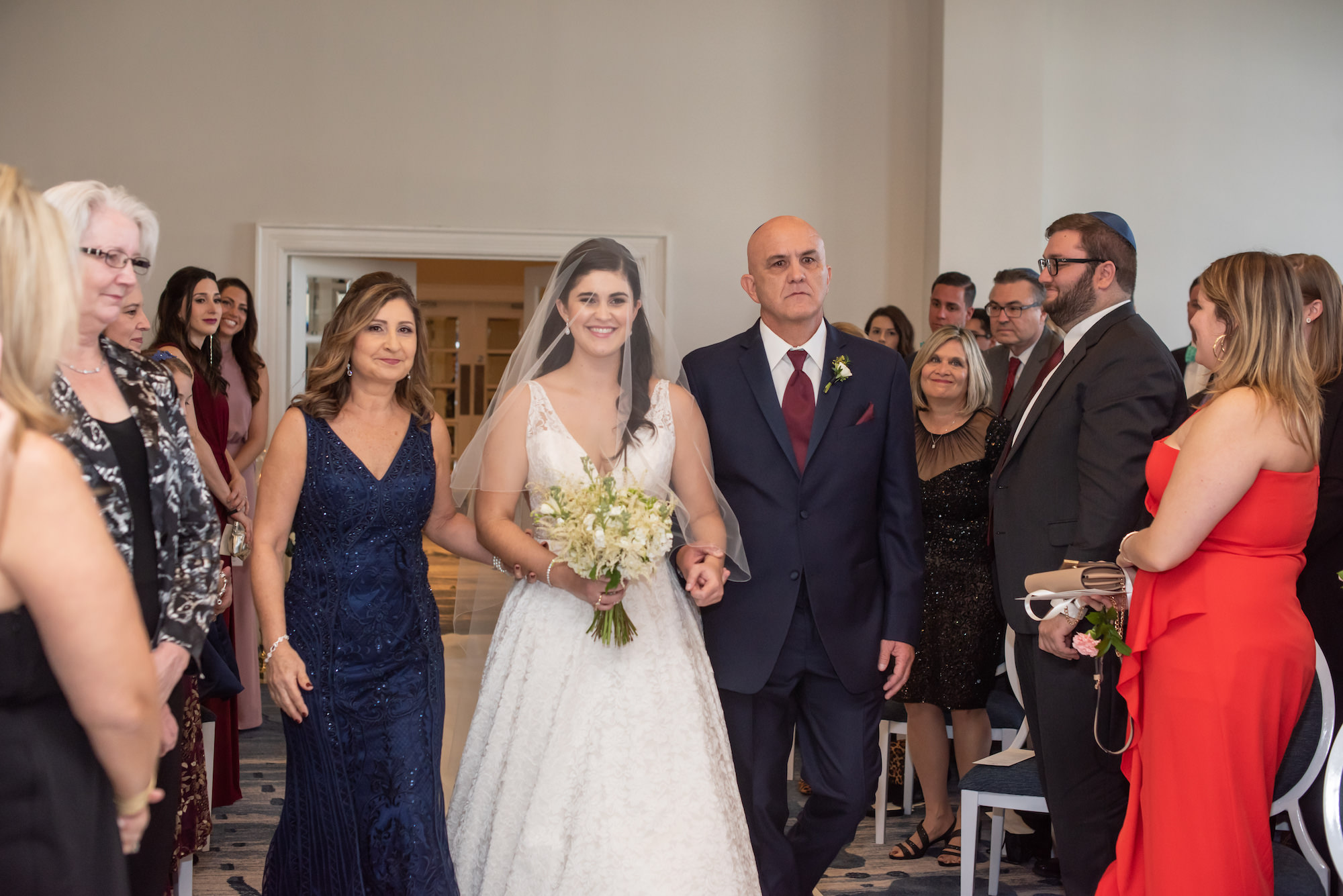 Classic Bride, Mother and Father Processional Walking Down the Wedding Ceremony Aisle Portrait