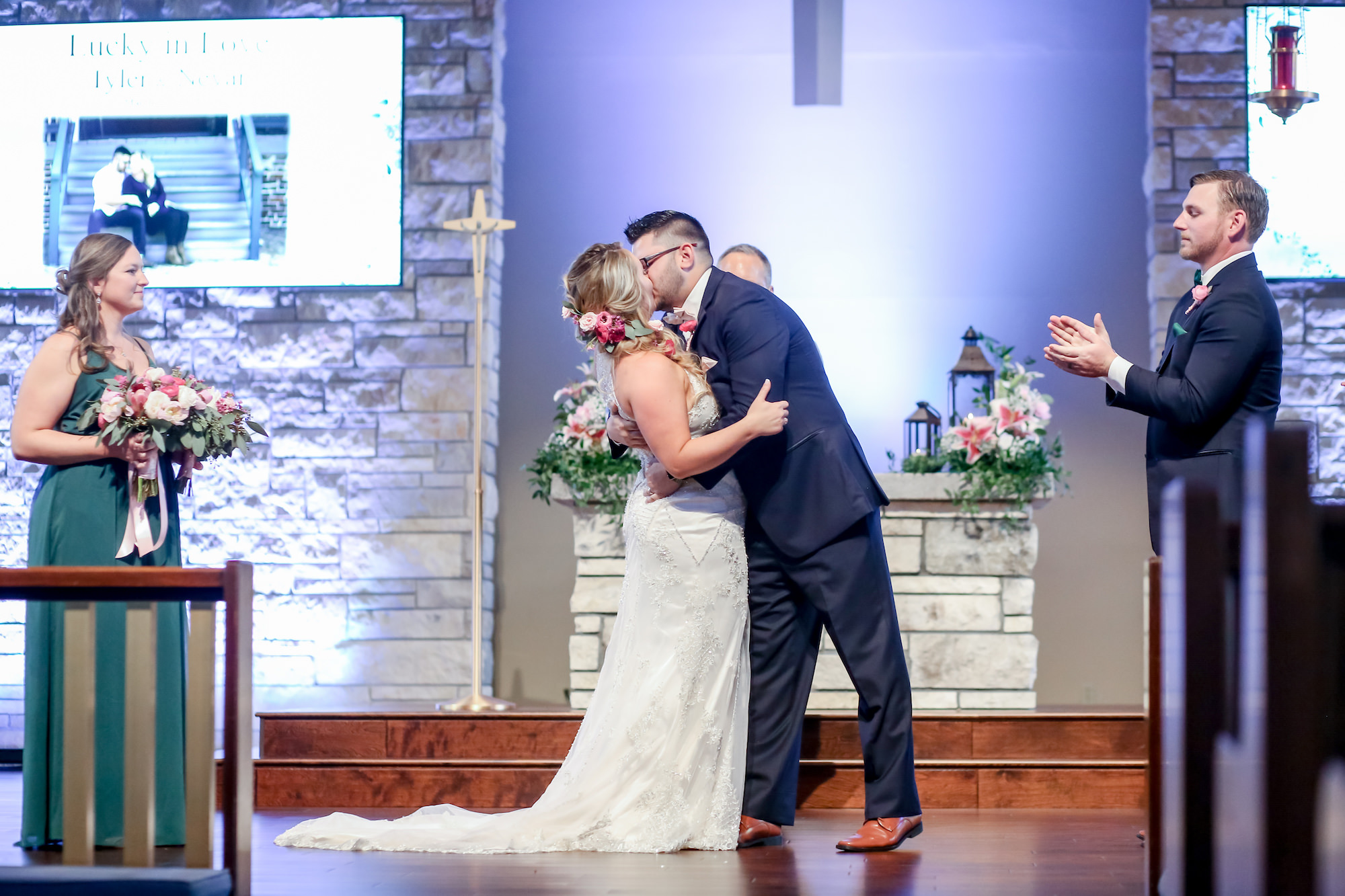Florida Bride and Groom Kiss at the Alter, Bride Wearing Sleeveless Maggie Sottero Wedding Dress | Florida Wedding Photographer Lifelong Photography Studios