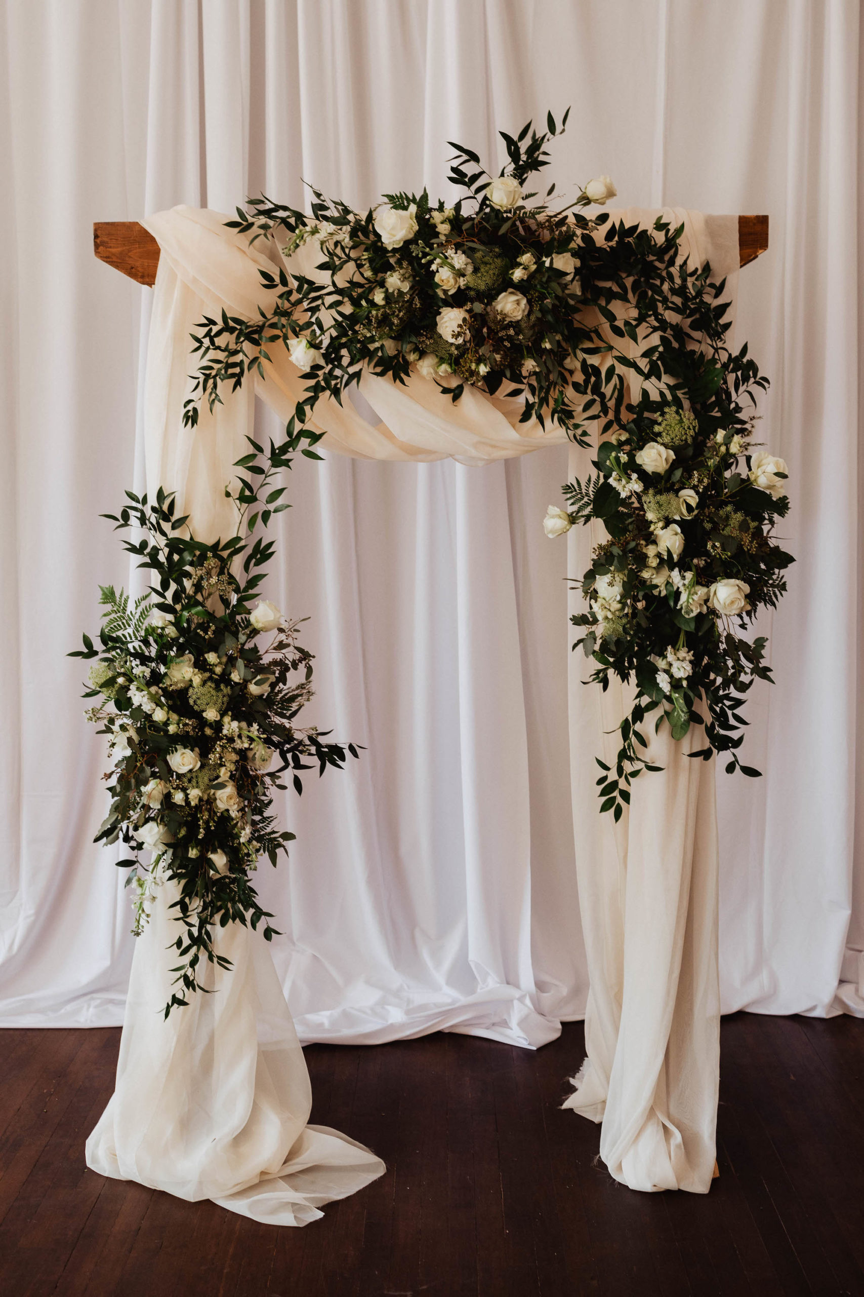 Simple, Elegant Wedding Ceremony Decor, Arch with White Draping and Greenery Eucalyptus and Ivory Roses Arch