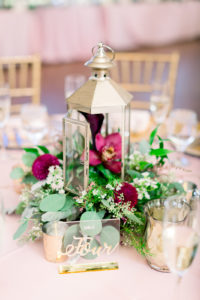 Rustic Elegant Wedding Ballroom Reception Venue, Small Brushed Gold Lantern with Organic Eucalyptus, Greenery and Maroon Floral Arrangement, Clear Acrylic with Gold Calligraphy Table Number Sign | Tampa Bay Wedding Photographer Shauna and Jordon Photography