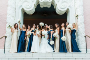 St. Pete Bride in Hayley Paige Wedding Dress, Bridesmaids in Mix and Match Navy Blue and Gold Dresses, Flower Girl in White Dress Fun Bridal Party Portrait