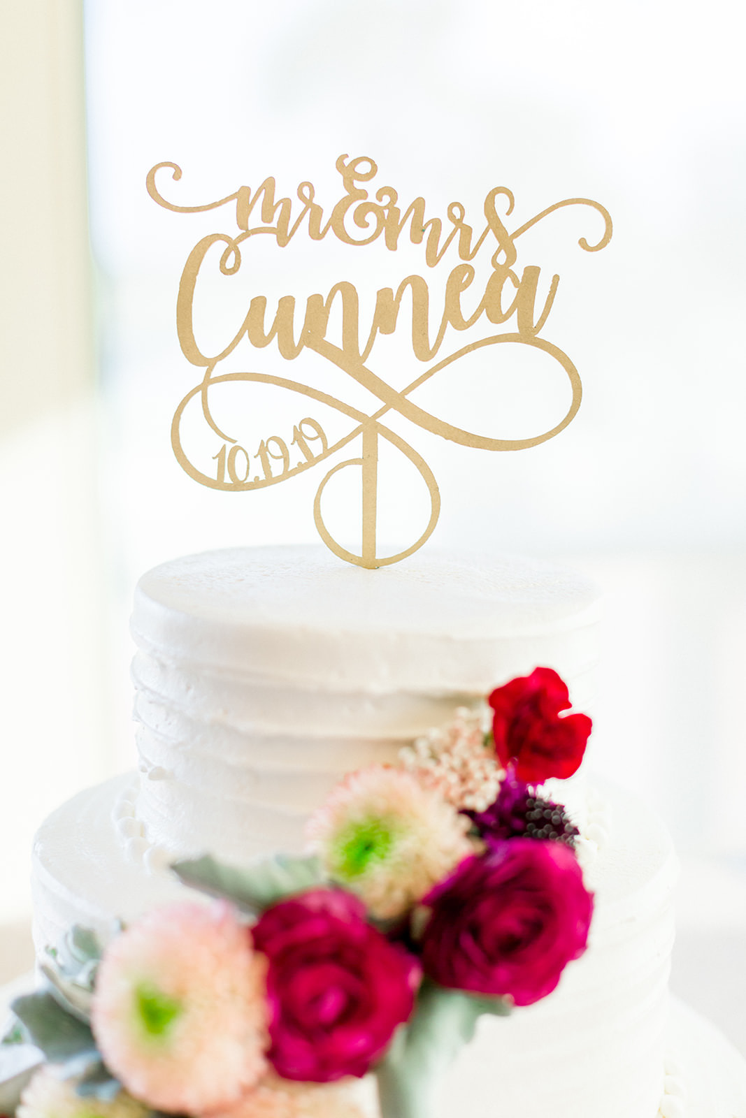 White Wedding Cake with Cascading Maroon, White and Purple Flowers and Gold Laser Cut Cake Topper | Tampa Bay Wedding Photographer Shauna and Jordon Photography