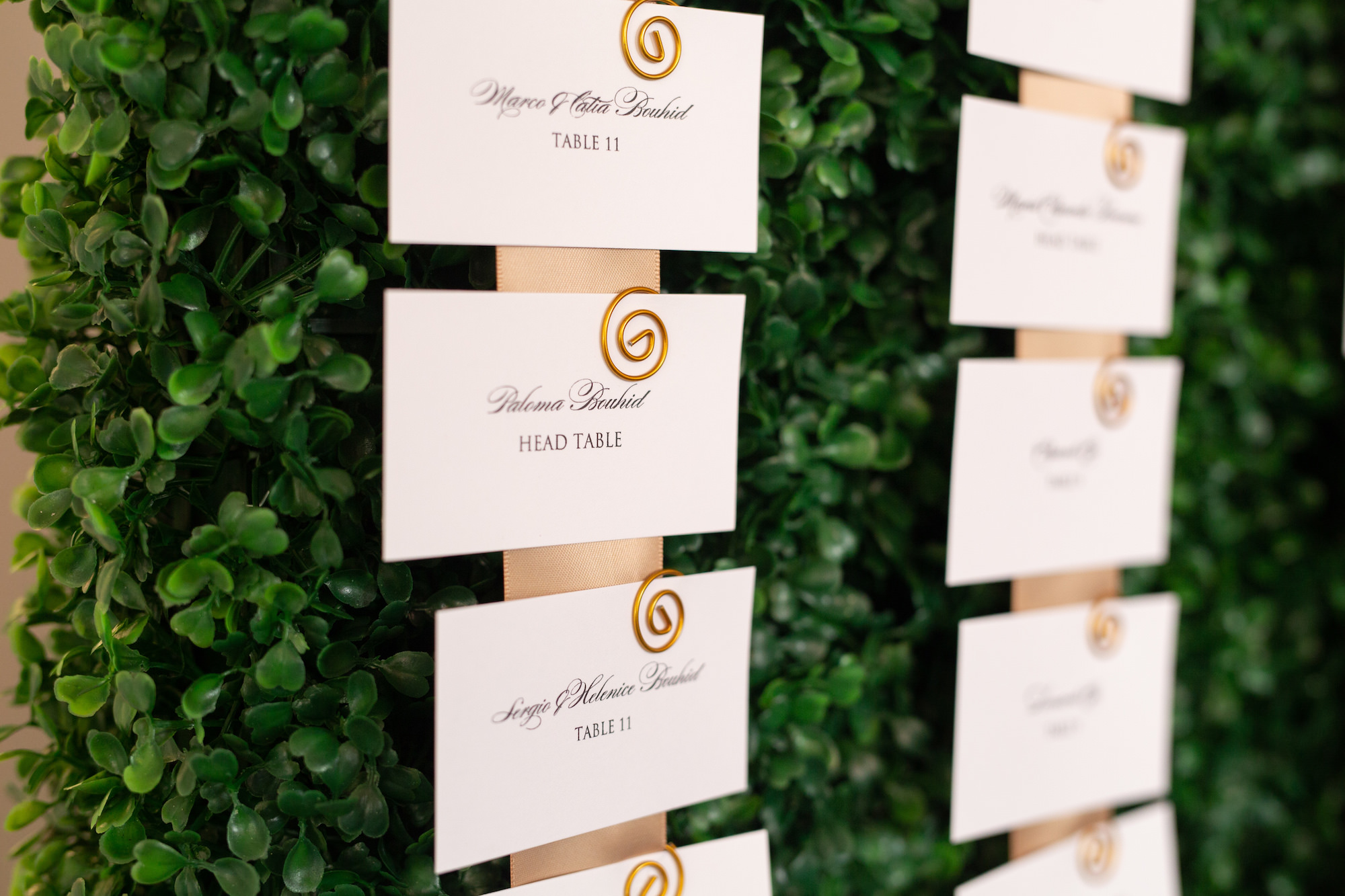 Classic Guest Seating Cards on Greenery Boxwood Wall | Tampa Bay Wedding Planner UNIQUE Weddings + Events