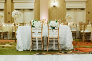 Elegant Ballroom Wedding Reception Decor, White Floral Table Linens on Sweetheart Table, Gold Chiavari Chairs, White Hydrangeas on Bride and Groom Chairs | Tropical Florida Waterfront Hotel Wedding Venue The Vinoy Renaissance St. Petersburg Resort and Golf Club