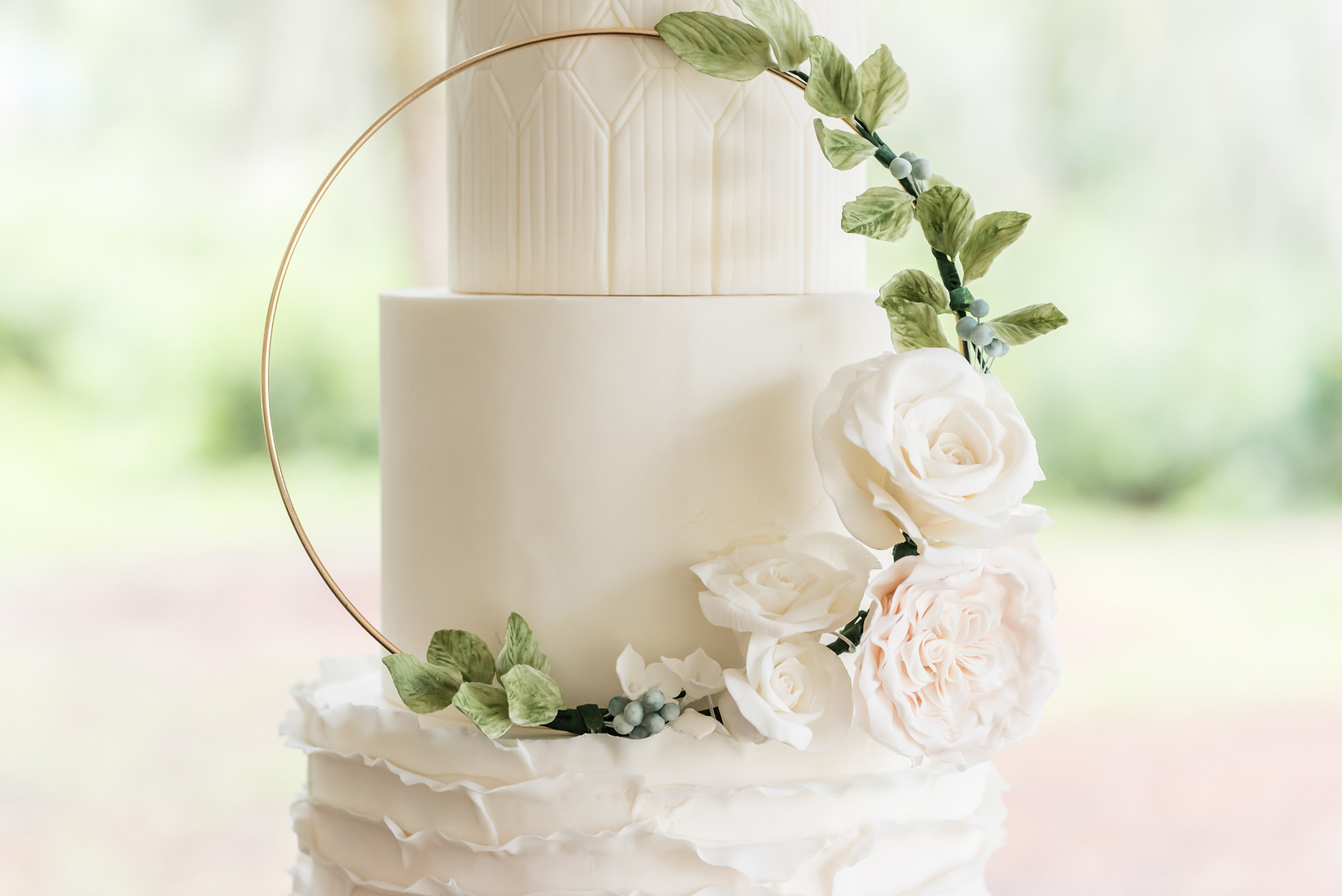 Dusty Rose Styled Wedding Shoot, Three Tier White Ruffled Bottom Tier Wedding Cake with Gold Circular Ornament with Greenery Leaves, Blush Pink and White Roses | Tampa Bay Wedding Planner Elegant Affairs by Design | Wedding Baker Tampa Bay Cake Company