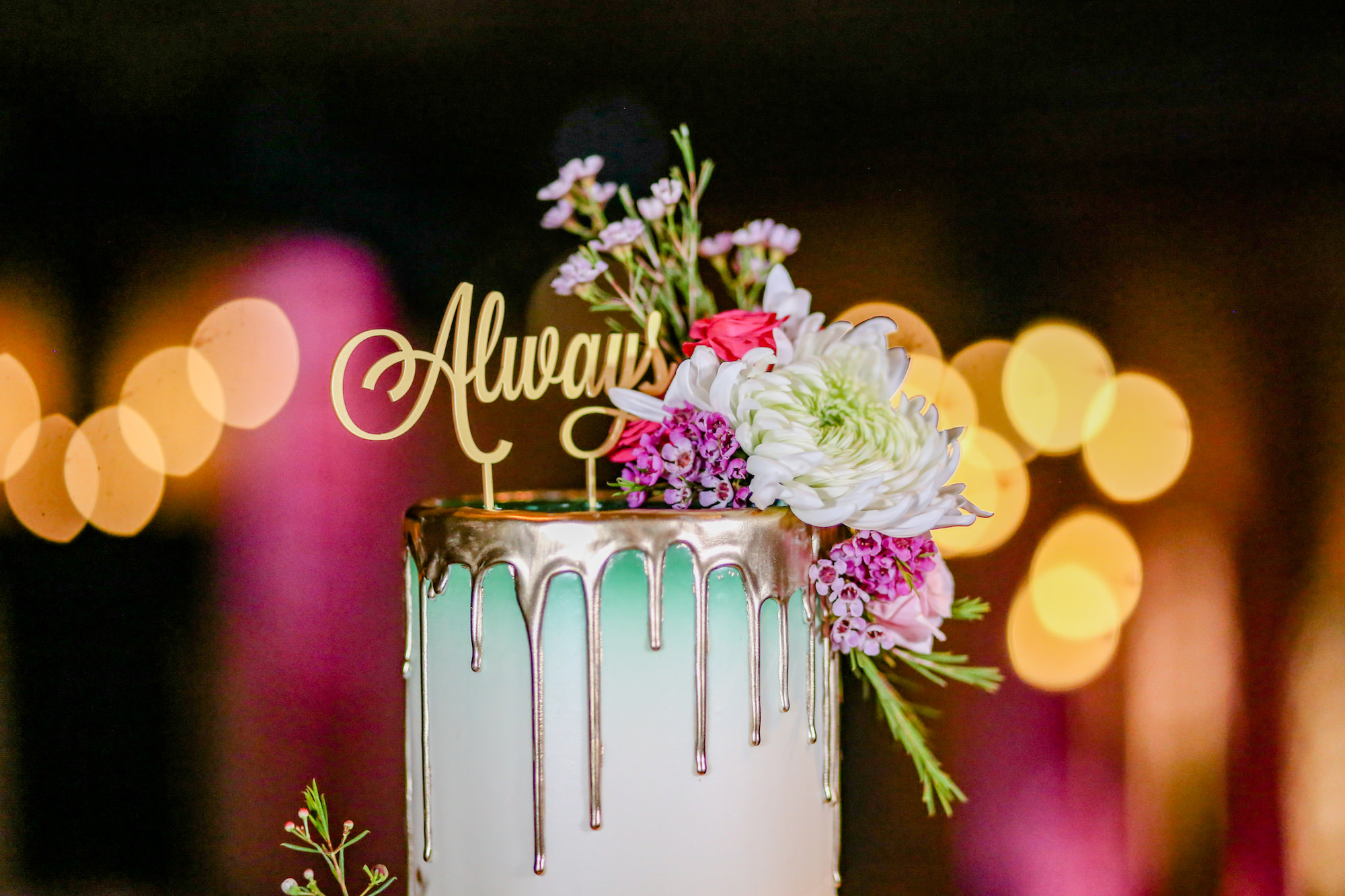 Top Tier of St. Patrick's Day Wedding Cake, Always Customs Cake Topper from Harry Potter, Emerald Green Buttercream Frosting, Gold Drip Icing, White, Purple, Pink Floral Accents | Florida Wedding Photographer Lifelong Photography Studios | Tampa Bay Cake Artist The Artistic Whisk