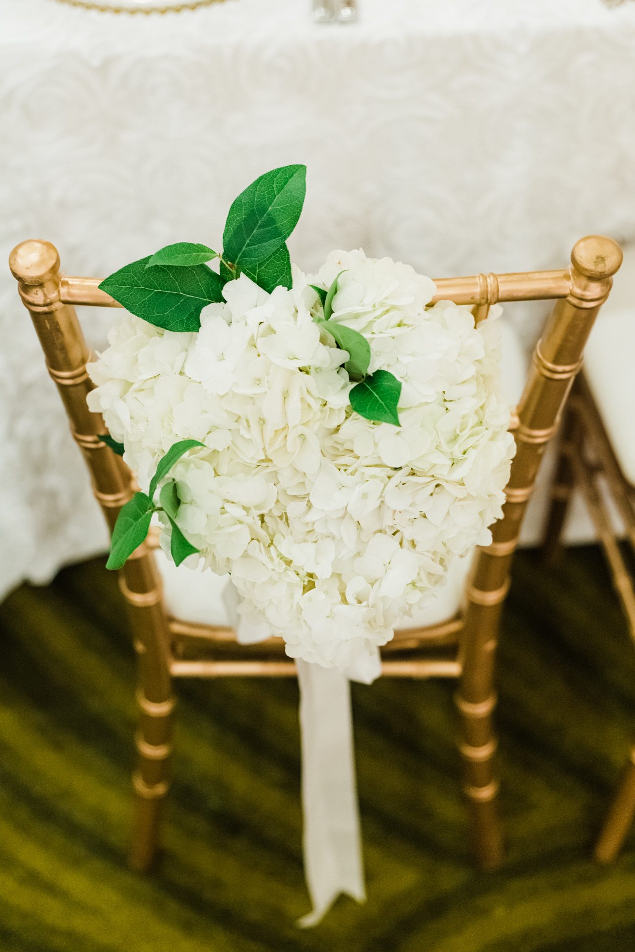 Elegant Wedding Reception Decor, White Hydrangea Floral Arrangement on Gold Chiavari Chair