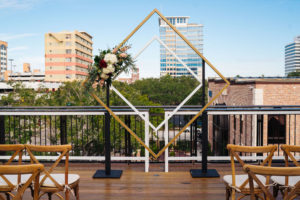 St. Petersburg Florida Wedding | St. Pete Venue Red Mesa Events | Rooftop Geometric Gold Ceremony Arch Backdrop