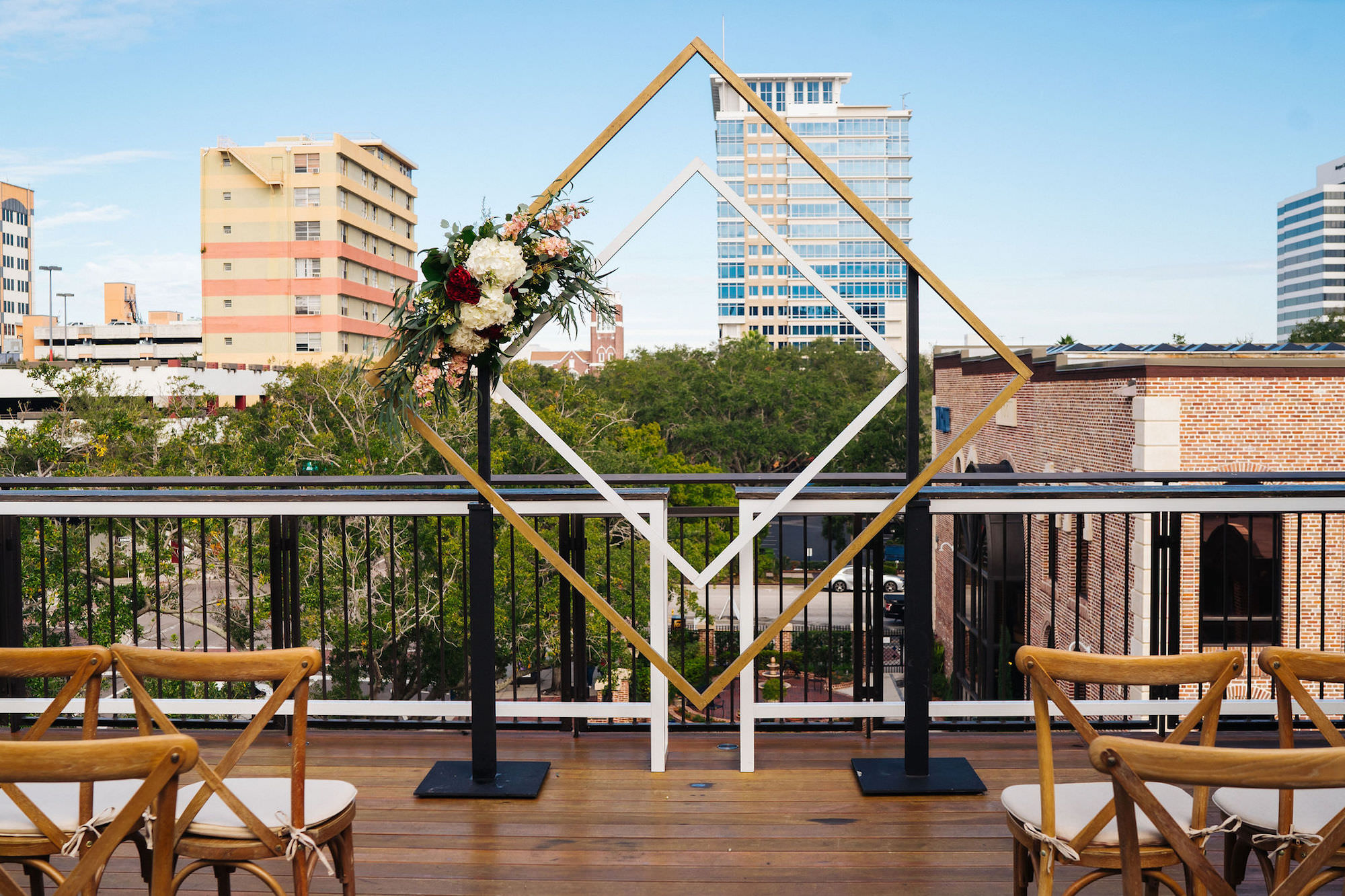 St. Petersburg Florida Wedding | St. Pete Venue Red Mesa Events | Rooftop Geometric Gold Ceremony Arch Backdrop