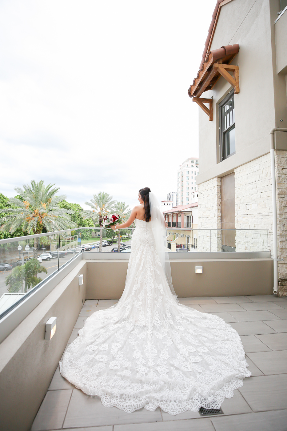 Romantic Bride in Lace Essense of Australia Wedding Dress Hotel Balcony Portrait | Wedding Photographer Lifelong Photography Studios