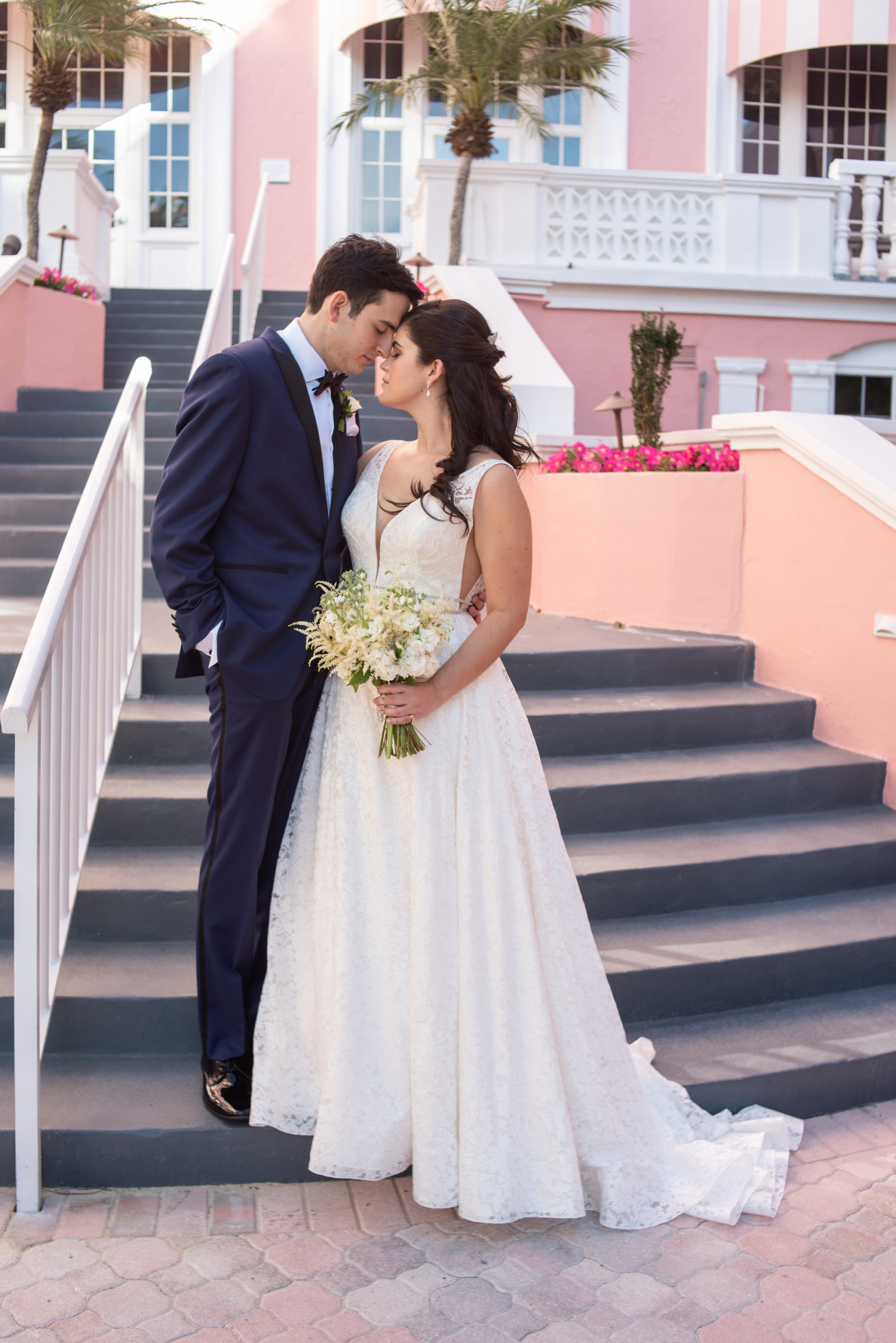 Florida Bride and Groom Wedding Portrait on Staircase at The Pink Palace | St. Petersburg Waterfront Hotel Wedding Venue The Don CeSar