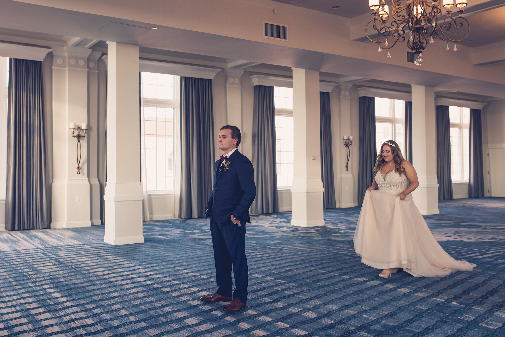 Tampa Bride and Groom First Look Wedding Portrait in The Pink Palace Historic St. Pete Wedding Venue The Don CeSar | Wedding Photographer Luxe Light Images