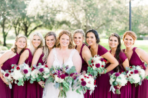 Bride and Bridesmaids in Maroon Mix and Match Dresses Holding Garden Greenery White, Red, Pink and Purple Floral Bouquets | Tampa Bay Wedding Photographer Shauna and Jordon Photography