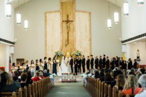 Traditional Bride and Groom Exchanging Wedding Vows During Ceremony | St. Pete Beach Wedding Venue St. John Vianney Catholic Church
