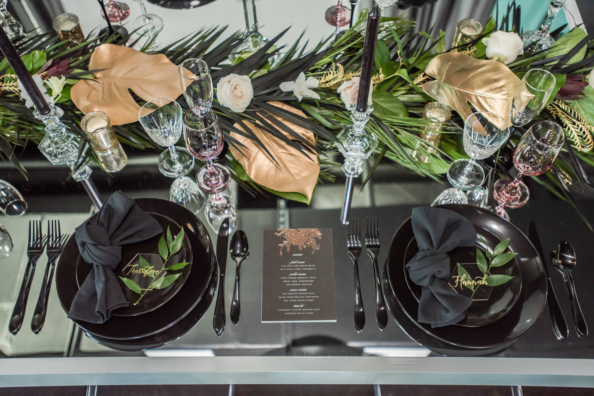 Dark Luxe, Romantic Wedding Reception Styled Shoot Decor, Black Tableware, Gold Painted Monstera Leaves, Palm Fronds, Blush Pink Roses Table Runner, Acrylic and Gold Script Font Seating Place Cards | Tampa Bay Wedding Planner Elegant Affairs by Design
