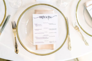 Wedding Reception Table Place Setting with Clear Glass Charger Plates with Gold Rim and Gold Flatware Silverware | Classic Traditional Menu Card on Champagne Gold Satin Napkin