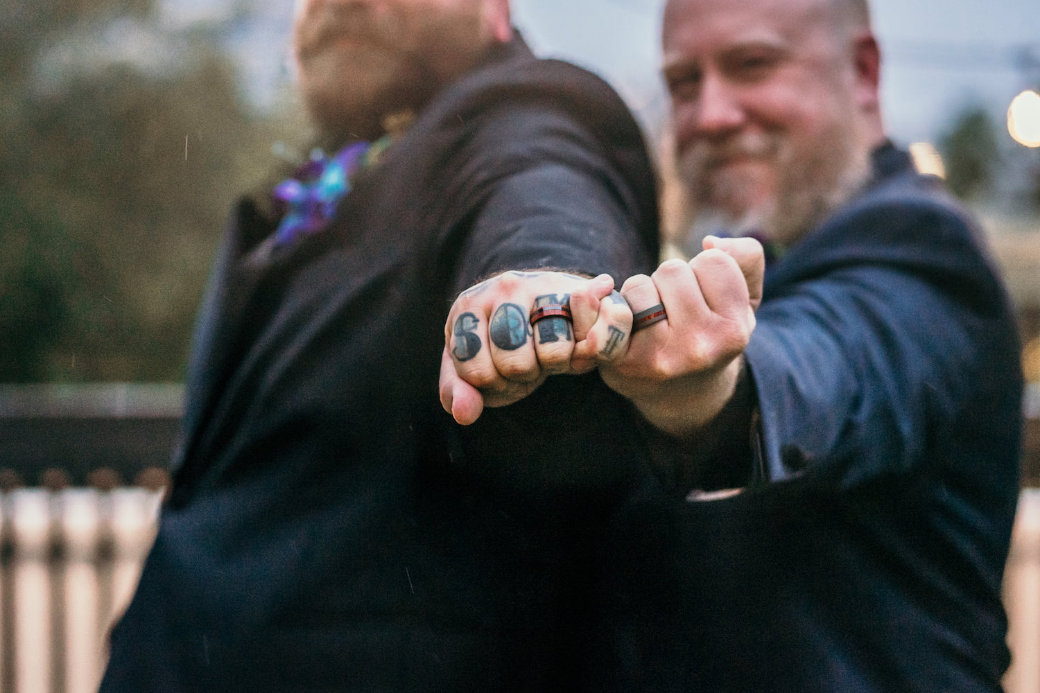 Creative Same Sex Gay Grooms Holding Pink Fingers with Wedding Bands and Hand Tattoo Wedding Portrait