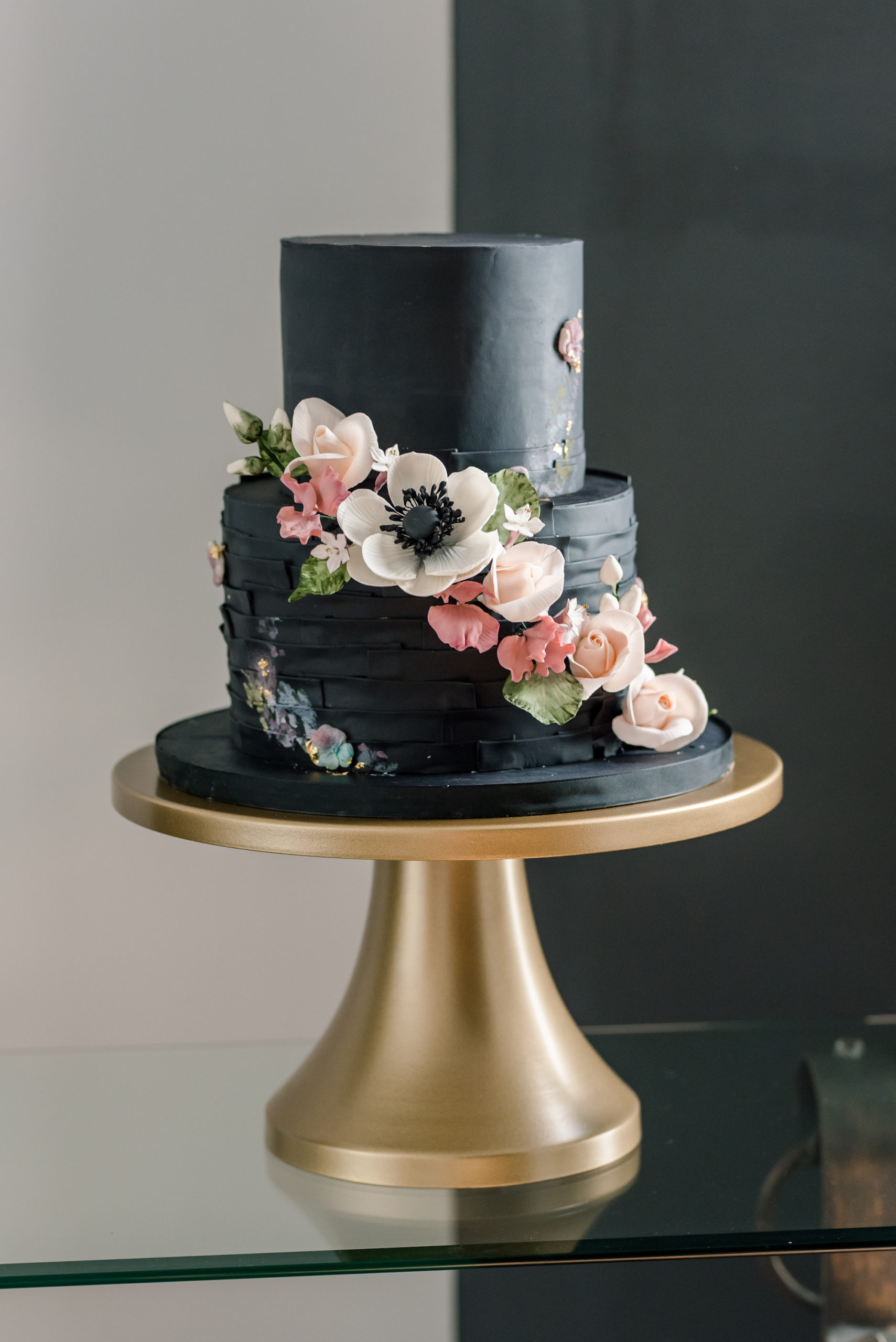 Unique Dark Luxe Black Two Tier Wedding Cake with Cascading White Anemone and Blush Pink Flowers | Tampa Bay Cake Company | Wedding Planner Elegant Affairs by Design