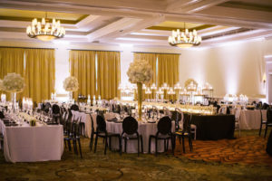 Classic Timeless Elegant Ballroom Wedding Reception Decor, Long Tables with White Linens, Black Chairs, Tall Gold Vases with White Floral Centerpieces | Clearwater Beach Wedding Hotel Venue Sandpearl Resort | Tampa Bay Wedding Planner Parties A'la Carte