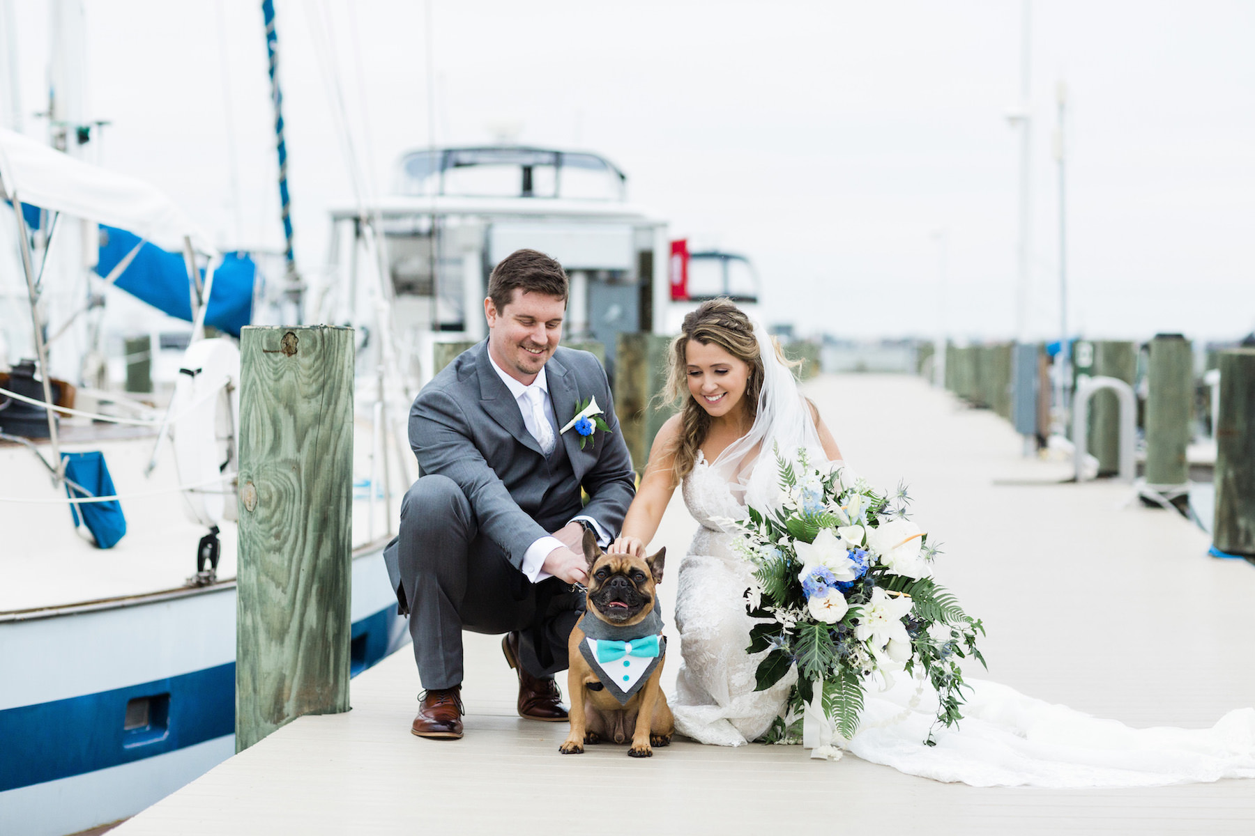 Bride and Groom Portraits at Marina Dock by Boats | St. Pete Wedding Venue Isla Del Sol | Bride and Groom Photos with Pet Dog of Honor | St. Petersburg Pet Planner Fairytail Pet Care