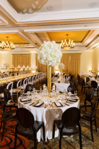 Classic Timeless Elegant Ballroom Wedding Reception Decor, Round Table with White Linen, Black Chairs, Tall Gold Vase with White Hydrangeas Centerpiece | Clearwater Beach Hotel Wedding Venue Sandpearl Resort | Tampa Bay Wedding Planner Parties A'la Carte
