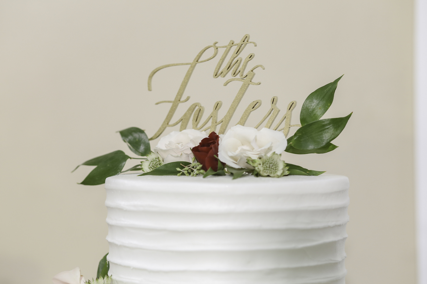 Simple Two Tier White Ruffle Textured Wedding Cake with Blush Pink and Red Roses and Greenery Leaves, Custom Gold Cake Topper | Wedding Photographer Lifelong Photography Studio | Tampa Bay Wedding Planner Blue Skies Weddings and Events | Wedding Cake Alessi Bakeries