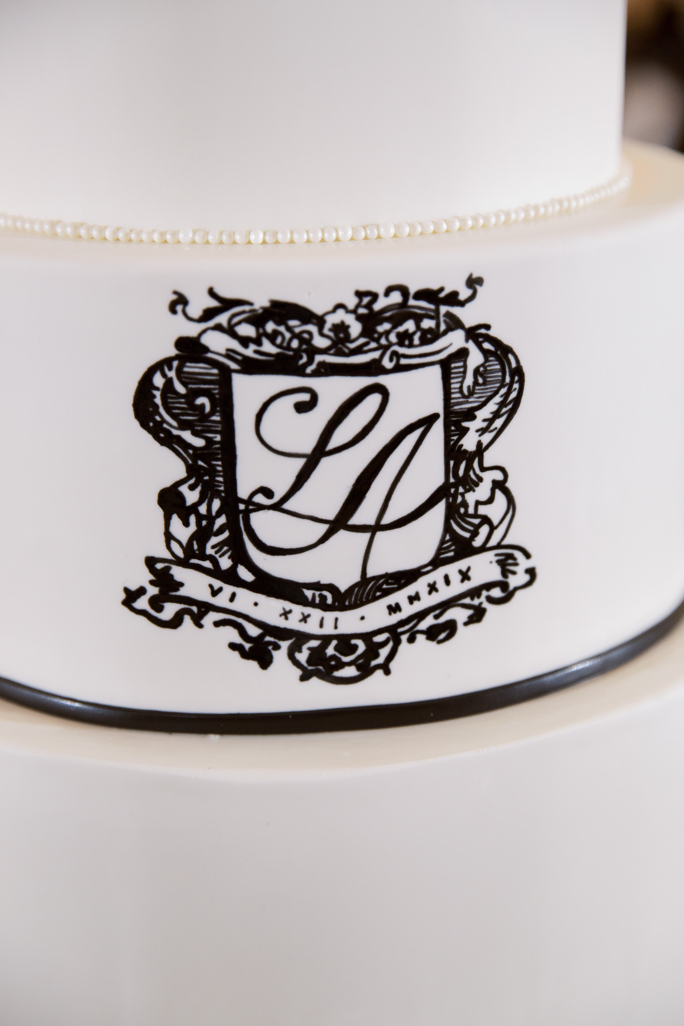 Classic Elegant White Wedding Cake with Custom Black Monogram