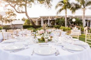 Elegant Outdoor Florida Lawn Wedding Reception with Hanging White Lanterns, White Linens and Peach, Pink and White Pineapple Centerpieces | Sarasota Wedding Venue The Resort at Longboat Key Club
